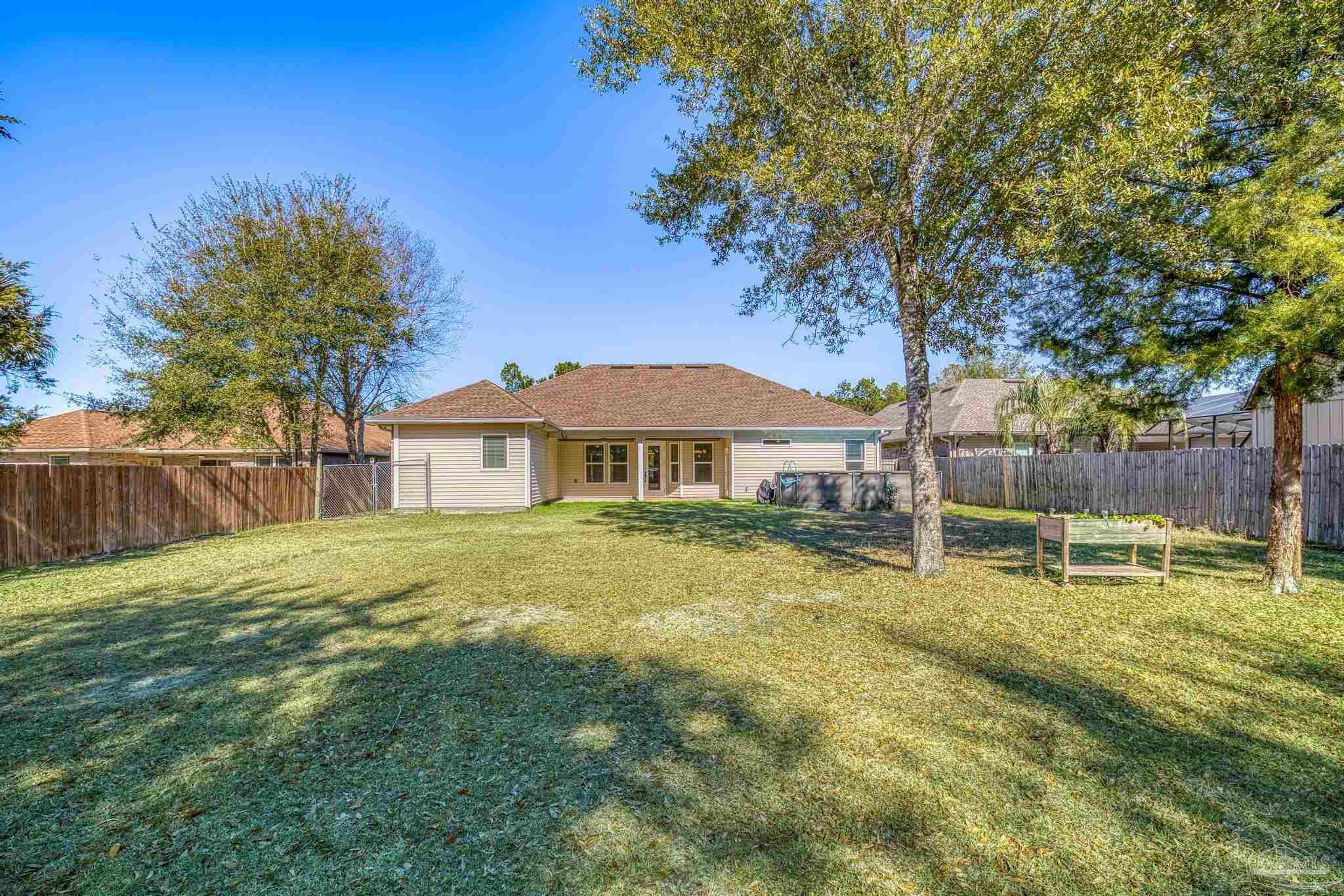 7933 Silver Maple Drive Milton, FL 32583 - Photo 56 of 70 a view of a house with a yard