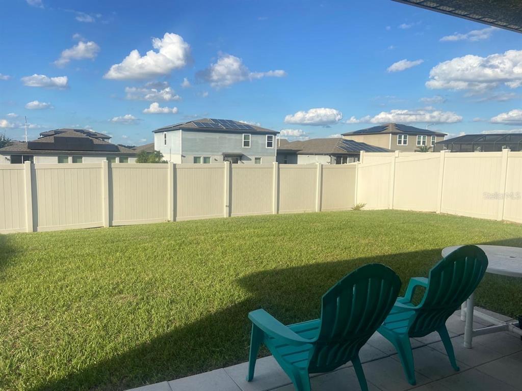 1176 Citrus Landings Boulevard Davenport, FL 33837 - Photo 12 of 15 a view of a chairs and table in patio