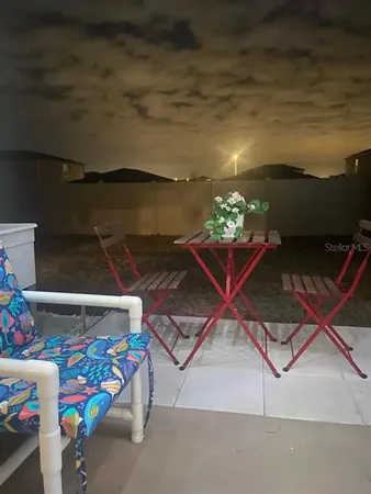 a room with toys and a potted plant