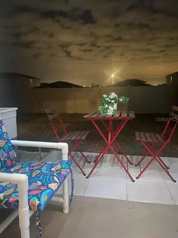 a room with toys and a potted plant