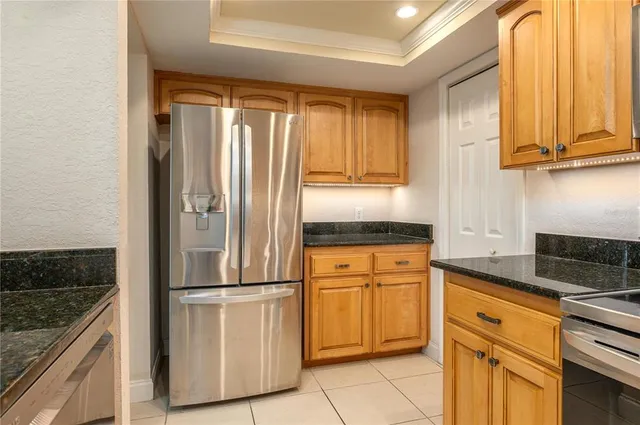 a kitchen with appliances cabinets and a sink