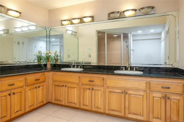 a bathroom with sink and mirror