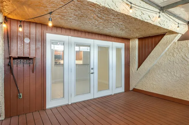 a view of balcony with wooden floor