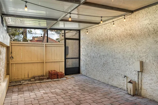 a view of a garage with wooden fence