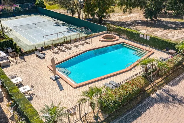 a view of a pool with a yard