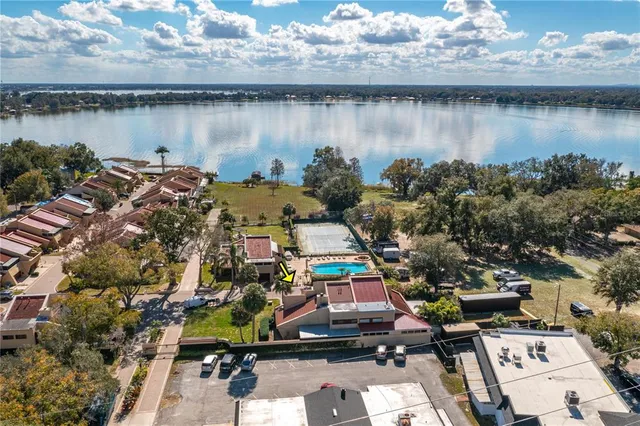 an aerial view of a house with a lake view