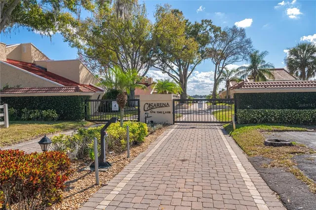 a view of a pathway with a garden