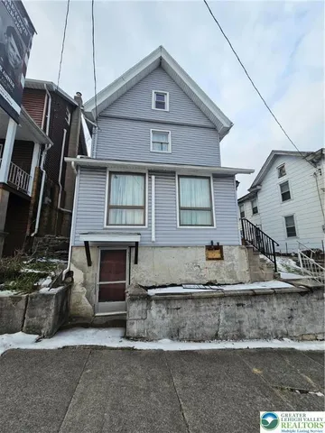 a front view of a house with garage