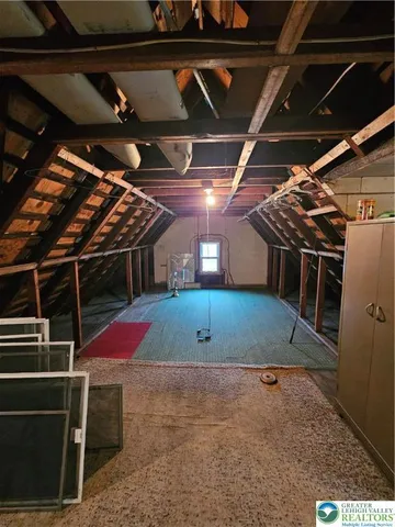 a room with water heater and storage