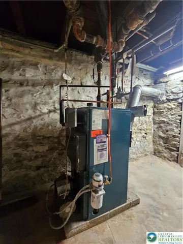 a view of a dry yard with wooden fence