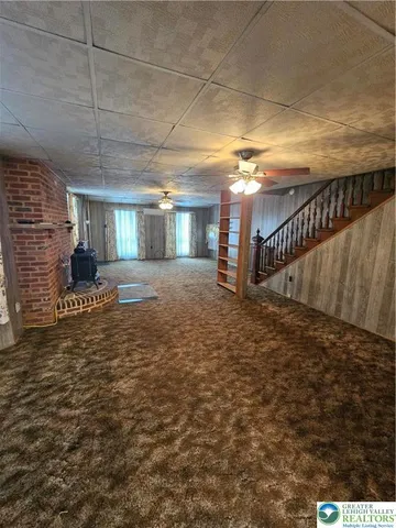 a view of a hallway with staircase