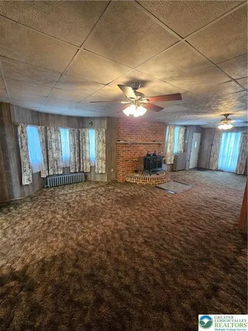 a view of a room with a kitchen