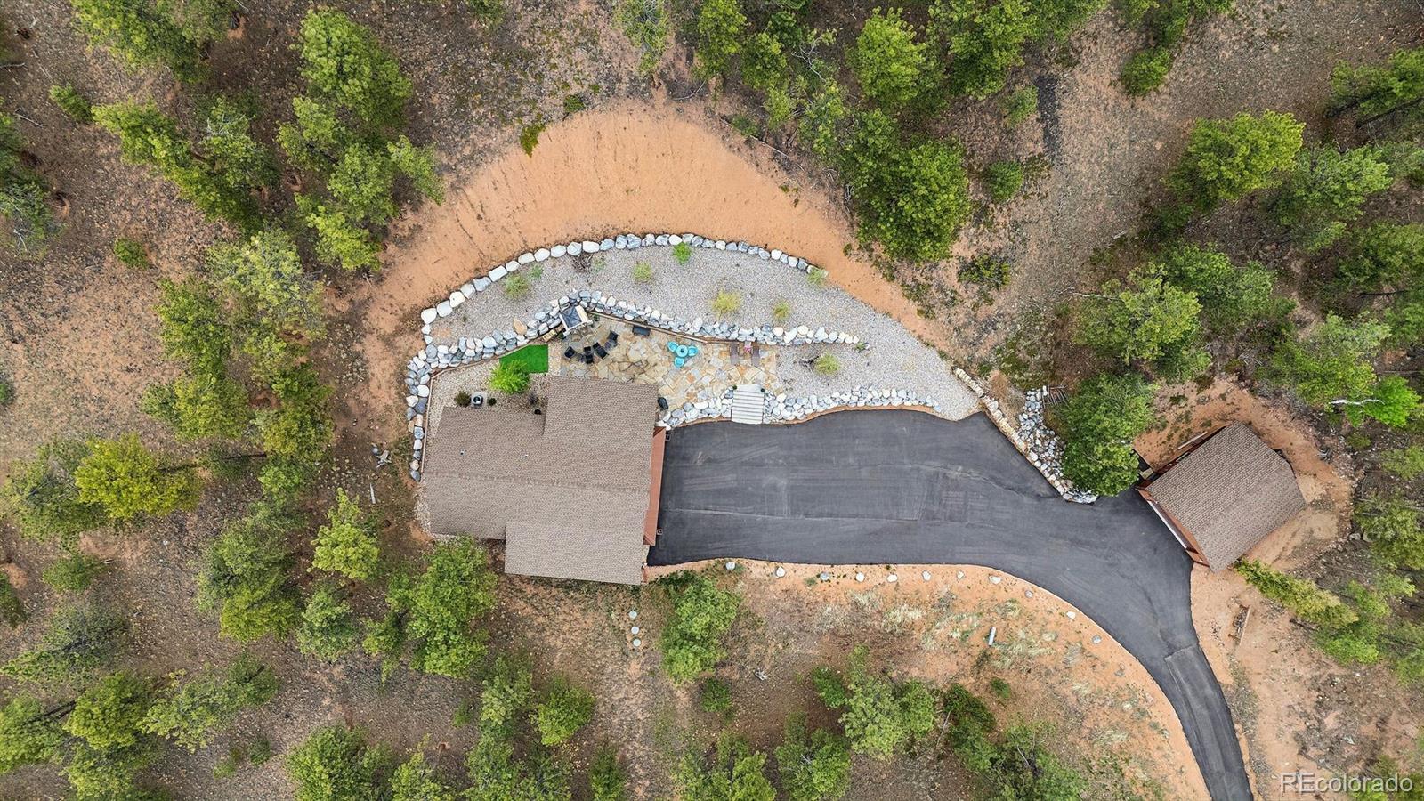 2894 County Road 43 Bailey, CO 80421 - Photo 6 of 40 an aerial view of a house with a yard and large trees