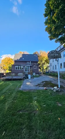 a view of a big house with a big yard