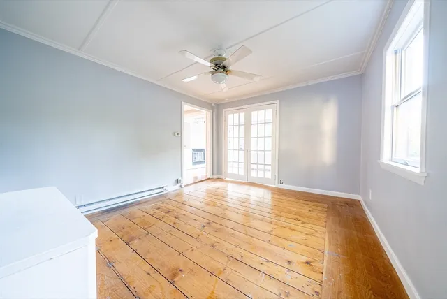 a view of an empty room with a window