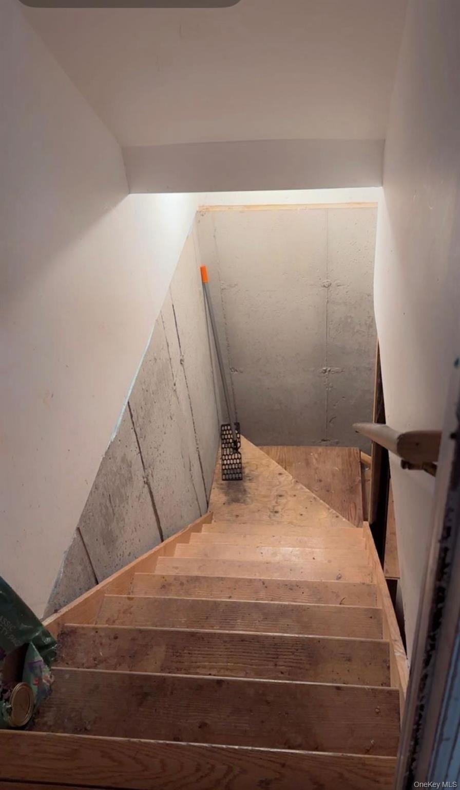 43 North Cozine Road Manorville, NY 11949 - Photo 30 of 42 a bedroom with a bed and a mirror