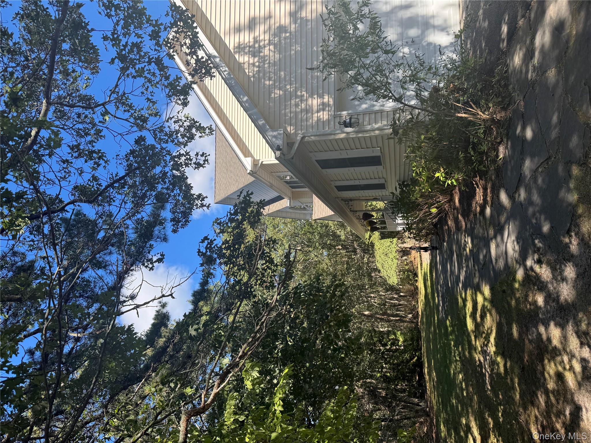 43 North Cozine Road Manorville, NY 11949 - Photo 3 of 42 a view of a house with a tree