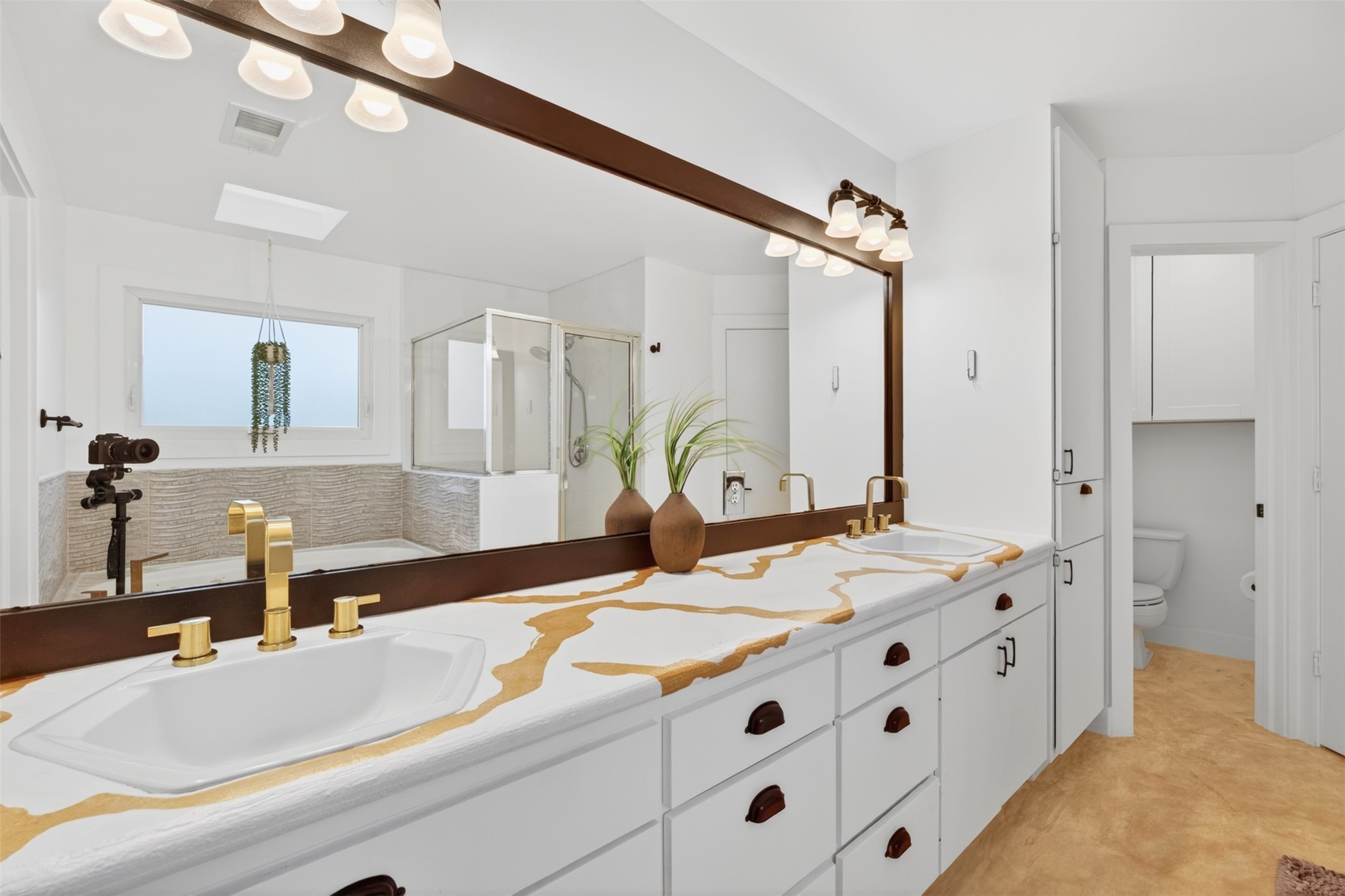 2716 Bagby Street Houston, TX 77006 - Photo 18 of 29 a bathroom with a sink double vanity and a mirror