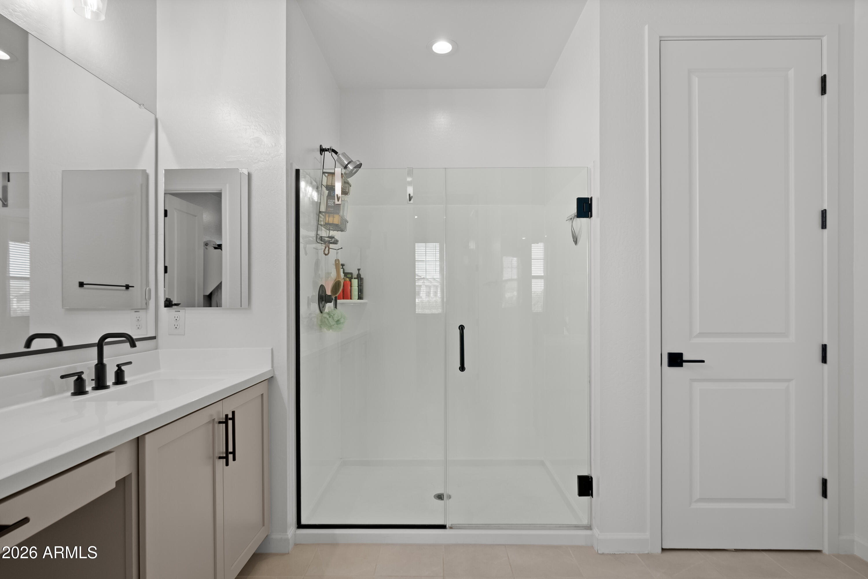 1989 West Hide Trail Phoenix, AZ 85085 - Photo 19 of 41 a bathroom with a shower sink and mirror