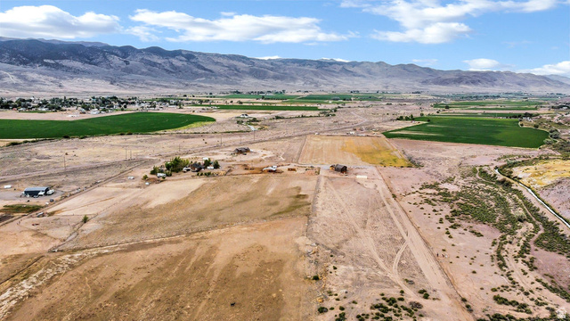 544 East 600 North, Unit 1 Joseph, UT 84739 - Photo 59 of 65 Expansive land parcel featuring open fields, distant mountain backdrop, and multiple existing structures