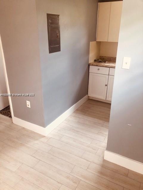 11241 Southwest 7th Terrace, Unit 1 Sweetwater, FL 33174 - Photo 13 of 34 a view of a kitchen with a sink and a stove
