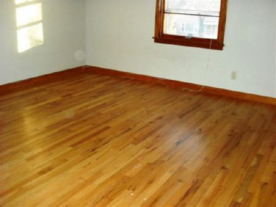 1608 Rural Street Rockford, IL 61107 - Photo 2 of 6 an empty room with wooden floor and windows