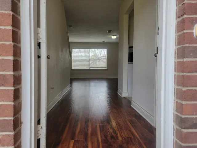 a view of gallery with wooden floor
