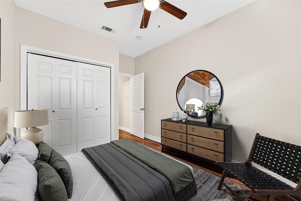 5407 Bryan Street, Unit B104 Dallas, TX 75206 - Photo 14 of 38 a bedroom with bed and wooden floor