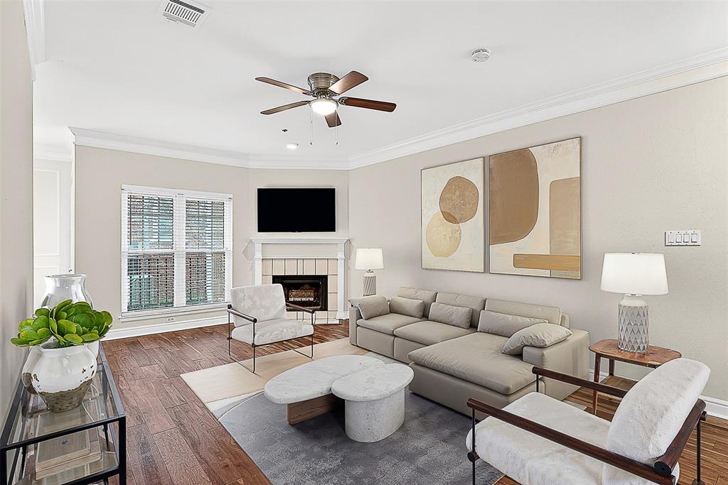5407 Bryan Street, Unit B104 Dallas, TX 75206 - Photo 3 of 38 a living room with furniture a fireplace and a potted plant