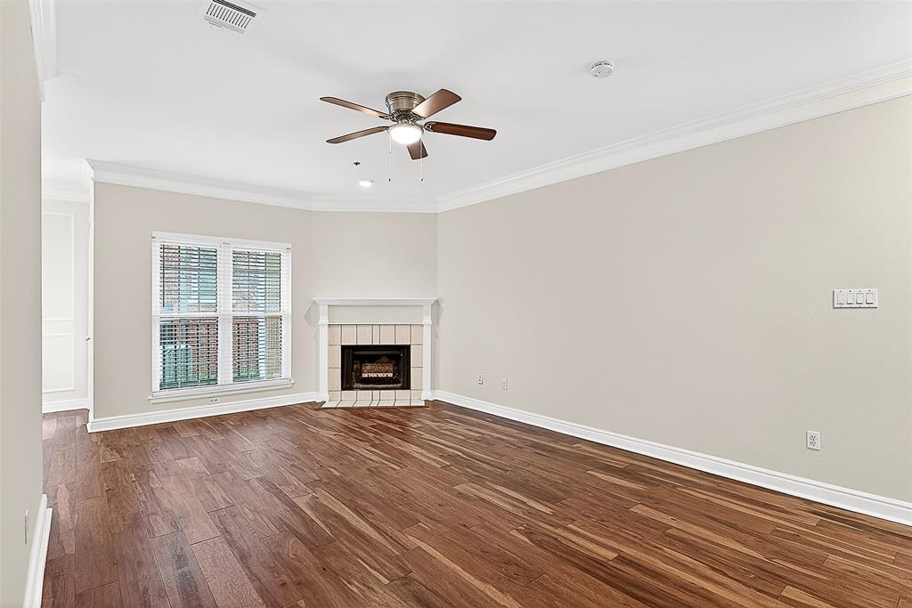 5407 Bryan Street, Unit B104 Dallas, TX 75206 - Photo 32 of 38 a view of an empty room with wooden floor and a window