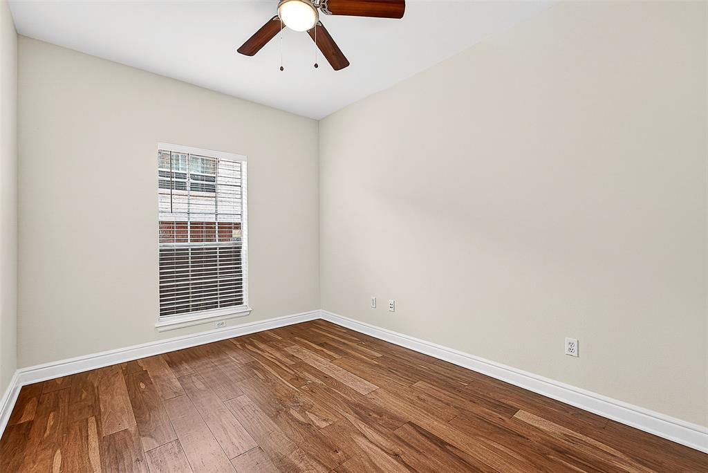 5407 Bryan Street, Unit B104 Dallas, TX 75206 - Photo 37 of 38 a view of a room with wooden floor and windows