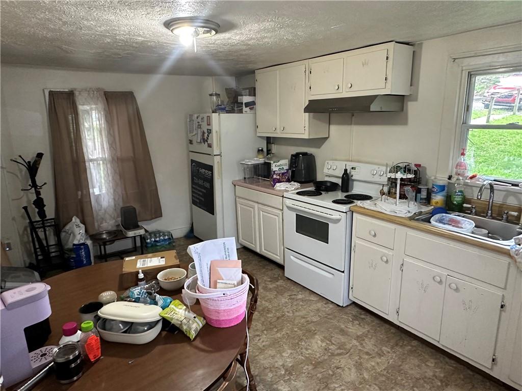 113 Morton Avenue Butler, PA 16001 - Photo 7 of 15 a kitchen with a sink stove and cabinets