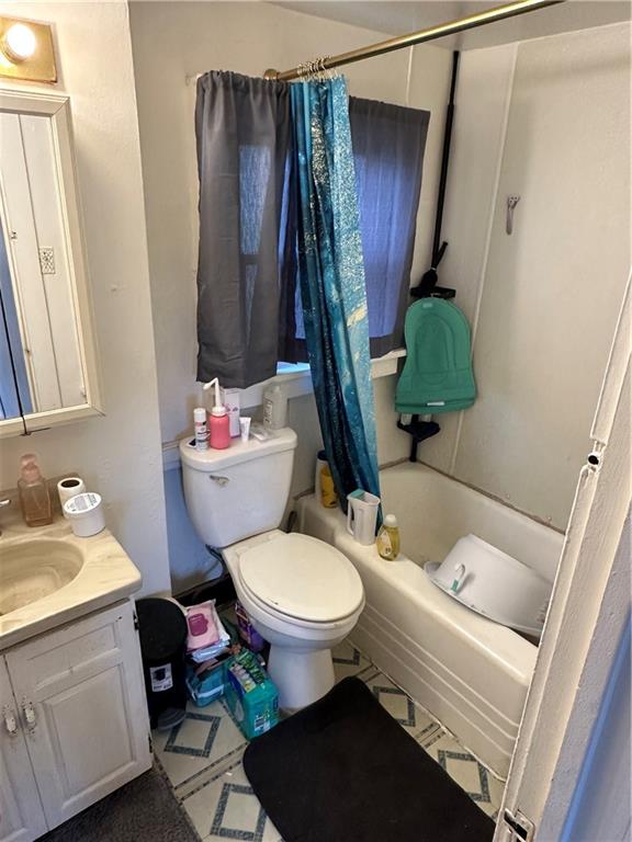 113 Morton Avenue Butler, PA 16001 - Photo 10 of 15 a bathroom with a toilet sink and mirror