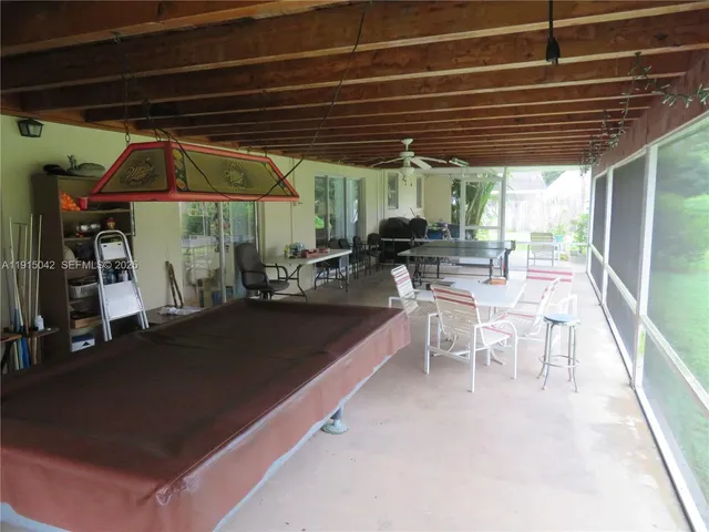 a view of a chairs and table in the patio