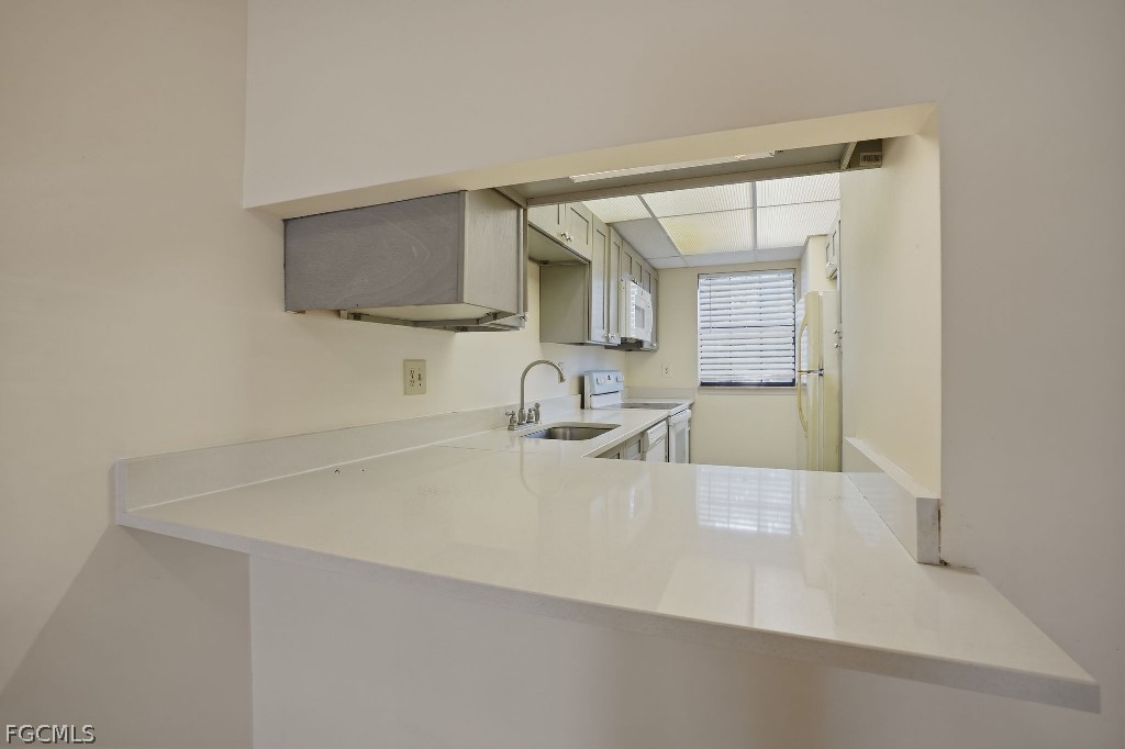 5369 Treetops Drive, Unit M102 Naples, FL 34113 - Photo 4 of 11 a bathroom with a sink and a mirror