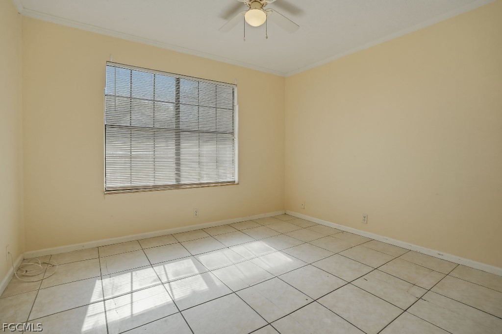 5369 Treetops Drive, Unit M102 Naples, FL 34113 - Photo 6 of 11 an empty room with windows
