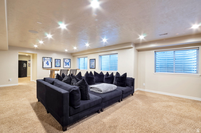 577 South Ridge Top Lane East North Salt Lake, UT 84054 - Photo 28 of 57 Expansive recreation room with room for multiple seating, gaming, and entertainment areas.