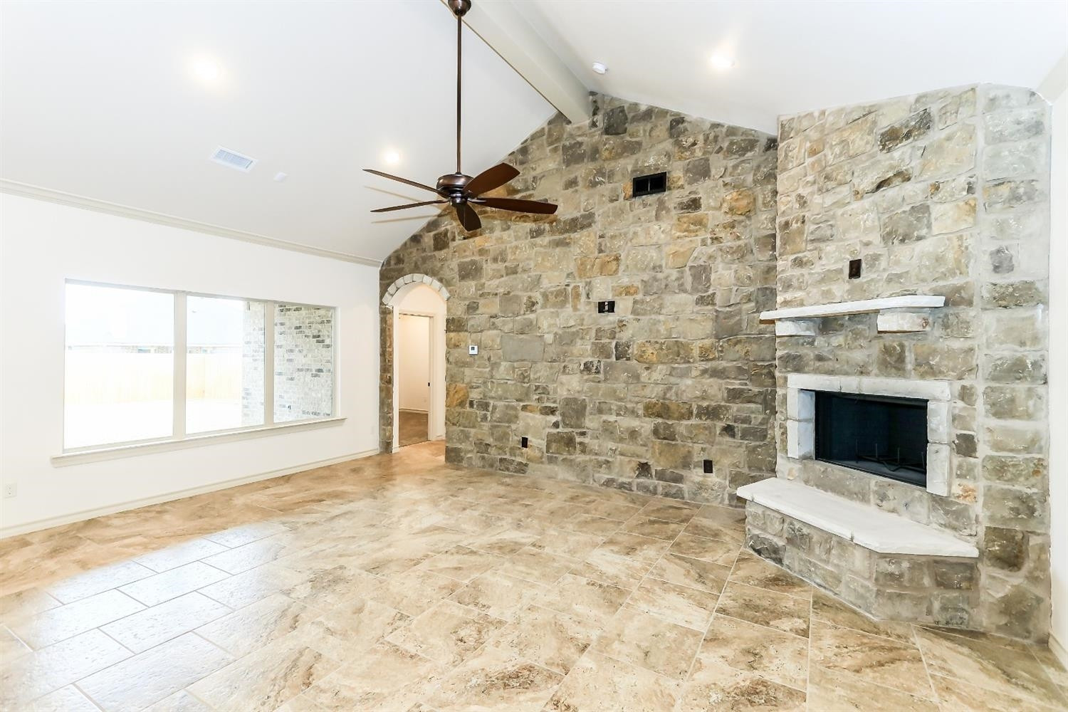 5234 Kemper Street Lubbock, TX 79416 - Photo 5 of 10 a view of empty room with a fireplace and wooden floor