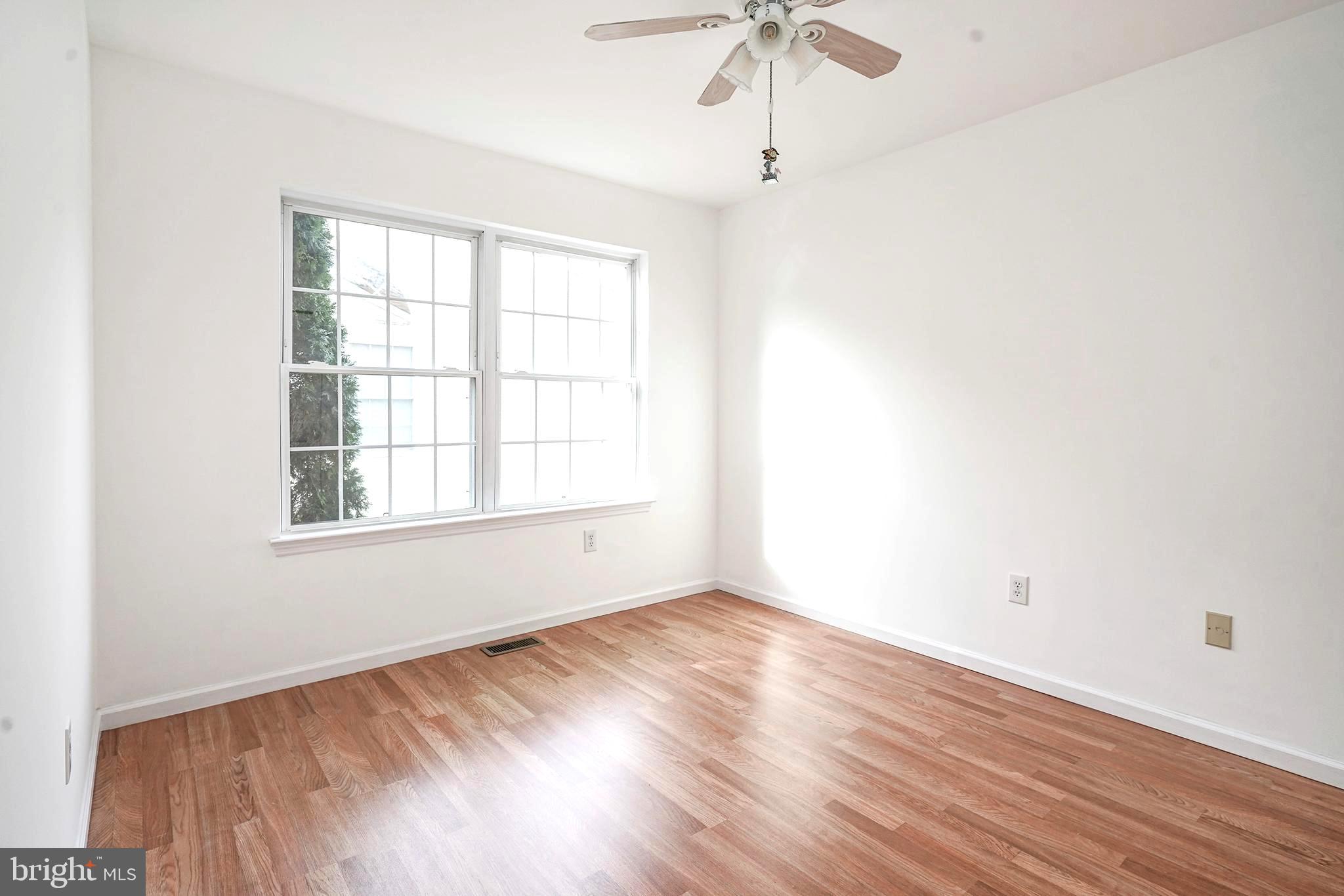 176 Trellis Lane Sewell, NJ 08080 - Photo 14 of 27 an empty room with a window and a ceiling fan