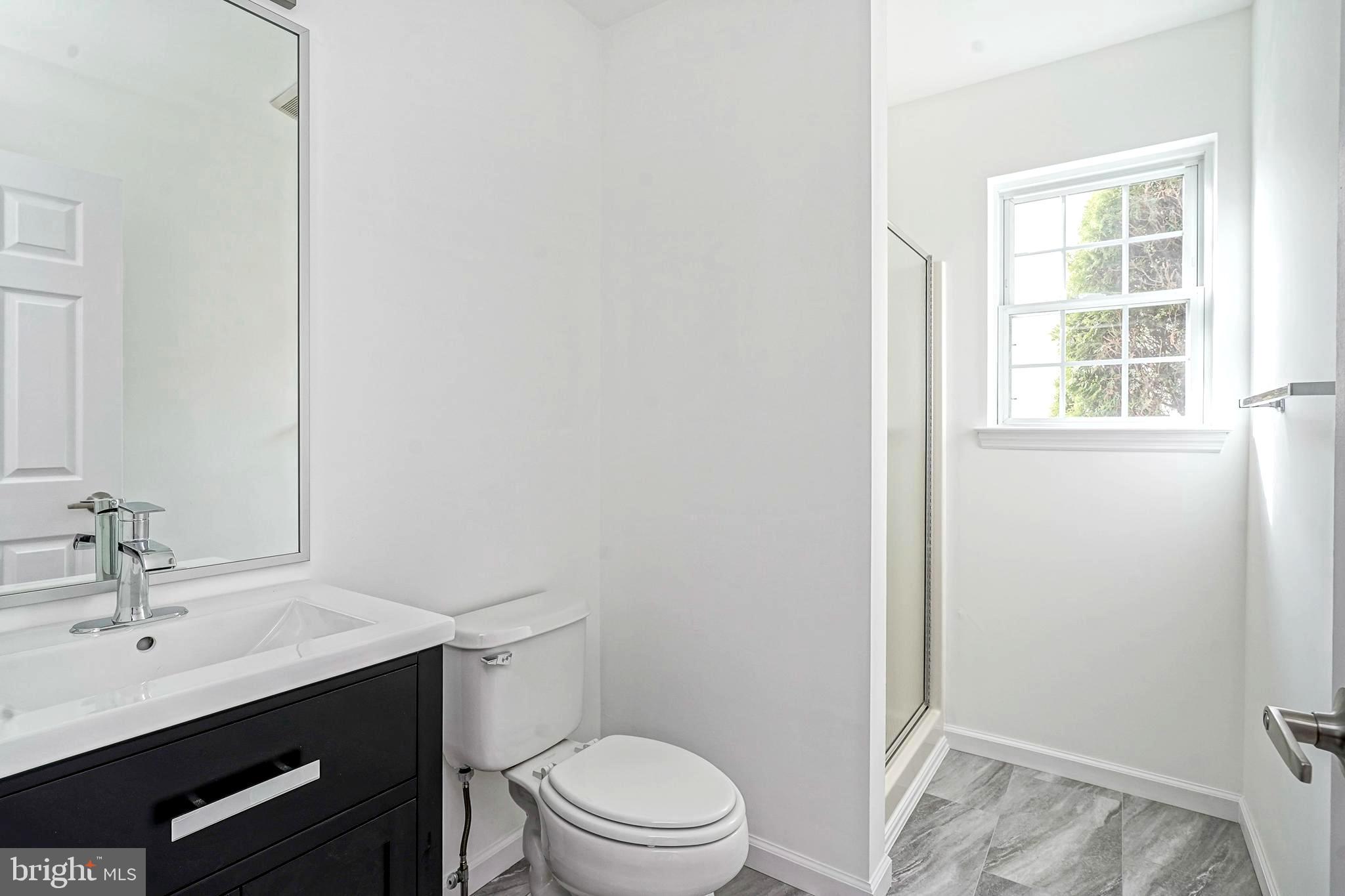176 Trellis Lane Sewell, NJ 08080 - Photo 16 of 27 a bathroom with a sink a toilet and a window