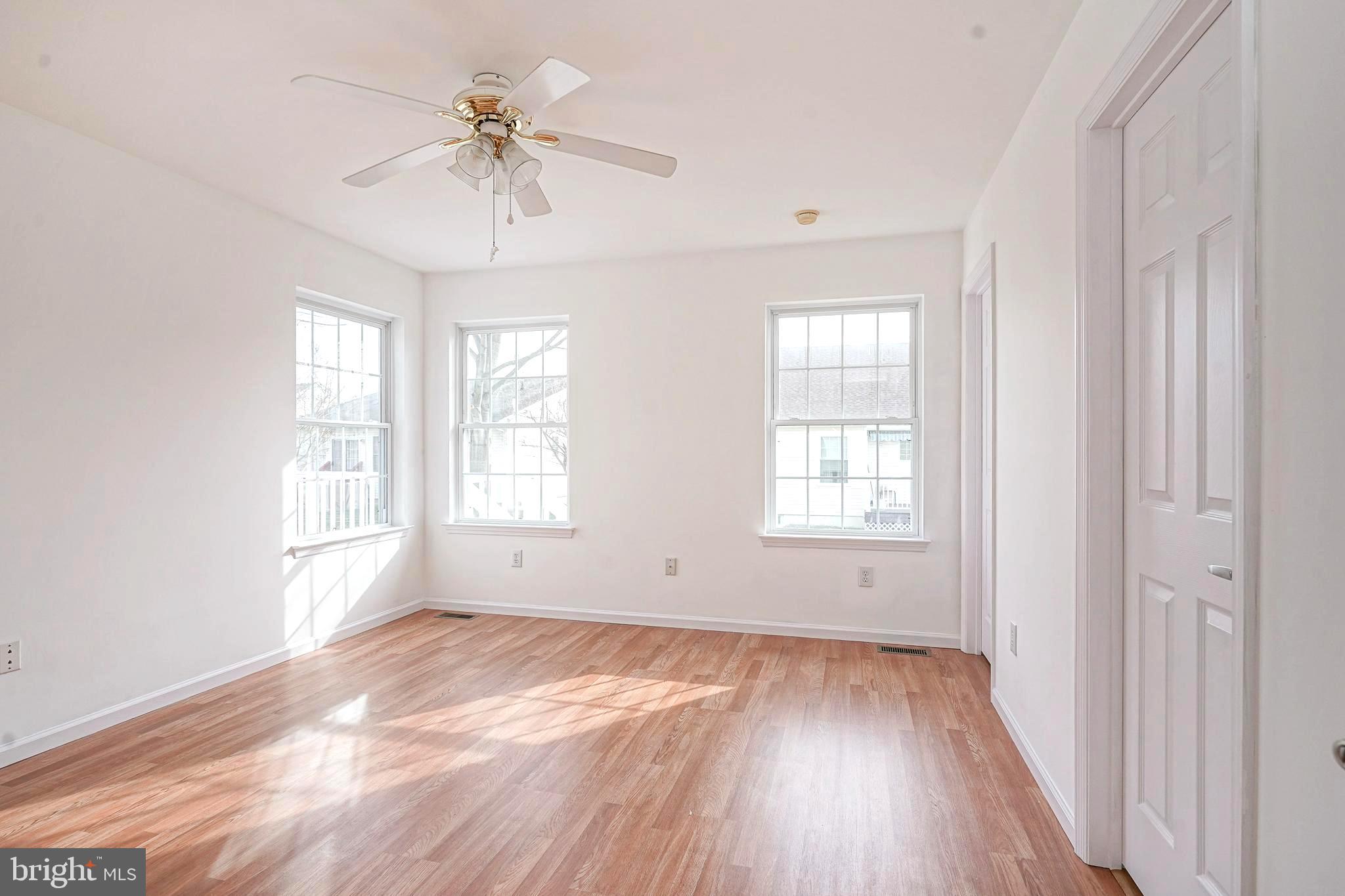 176 Trellis Lane Sewell, NJ 08080 - Photo 18 of 27 a view of empty room with wooden floor and fan