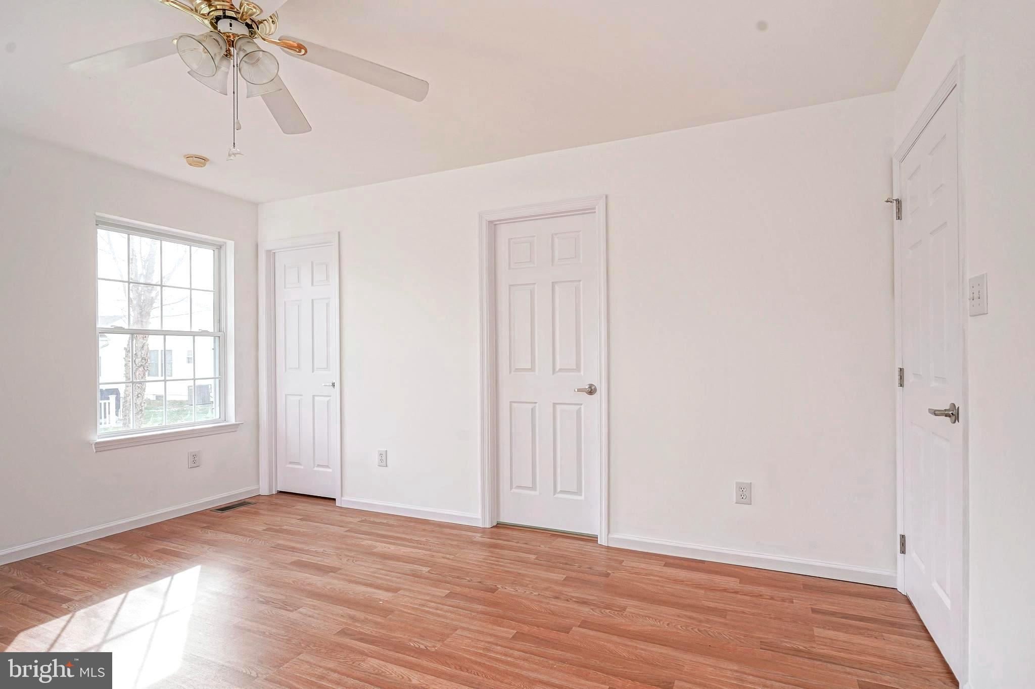 176 Trellis Lane Sewell, NJ 08080 - Photo 19 of 27 wooden floor in an empty room with a window