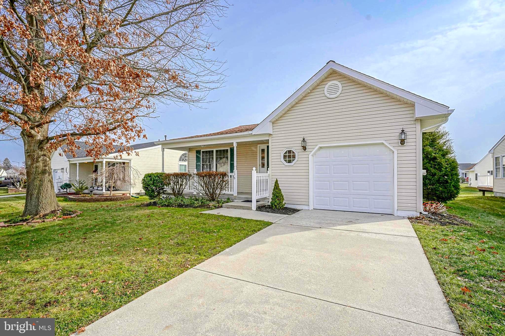 176 Trellis Lane Sewell, NJ 08080 - Photo 2 of 27 a front view of a house with a yard and garage