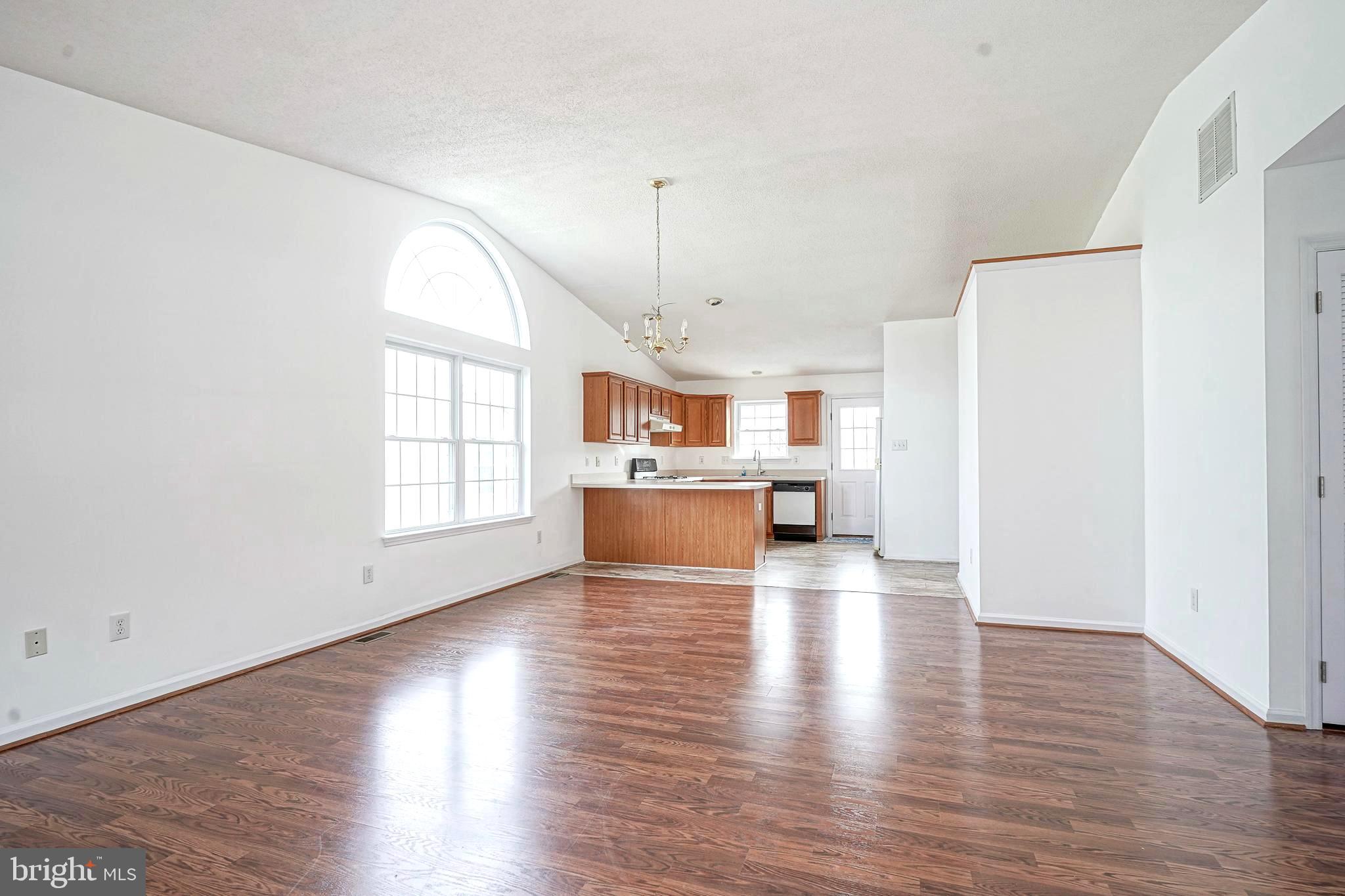 176 Trellis Lane Sewell, NJ 08080 - Photo 7 of 27 an empty room with wooden floor and windows