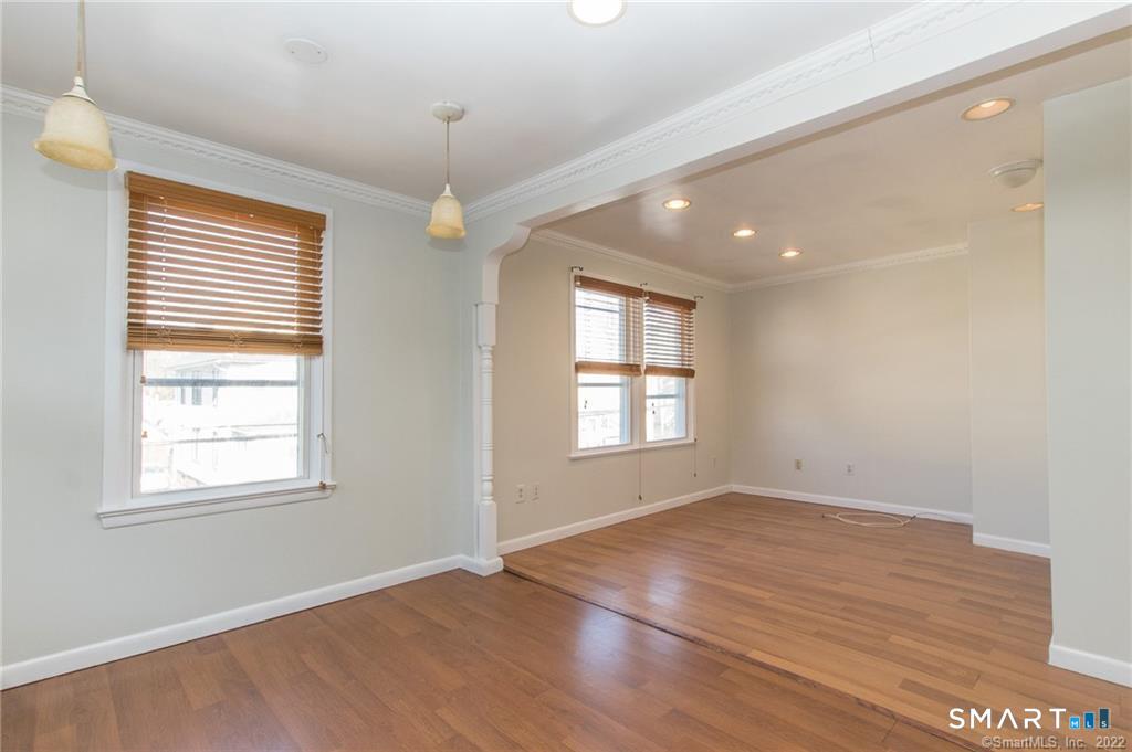18 Lawrence Street Norwalk, CT 06854 - Photo 20 of 31 a view of an empty room with wooden floor and a window