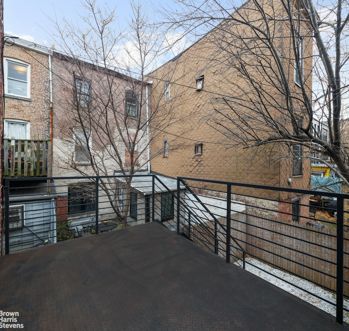 50 Eldert Street Brooklyn, NY 11207 - Photo 5 of 11 a view of a house with a street