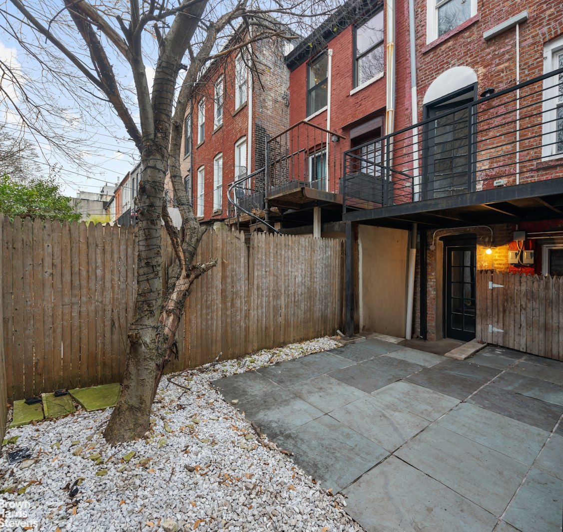 50 Eldert Street Brooklyn, NY 11207 - Photo 6 of 11 a front view of a building with glass door