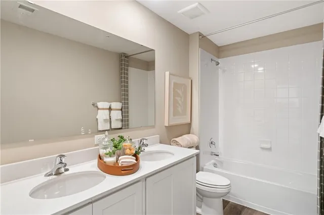 a bathroom with a sink and shower