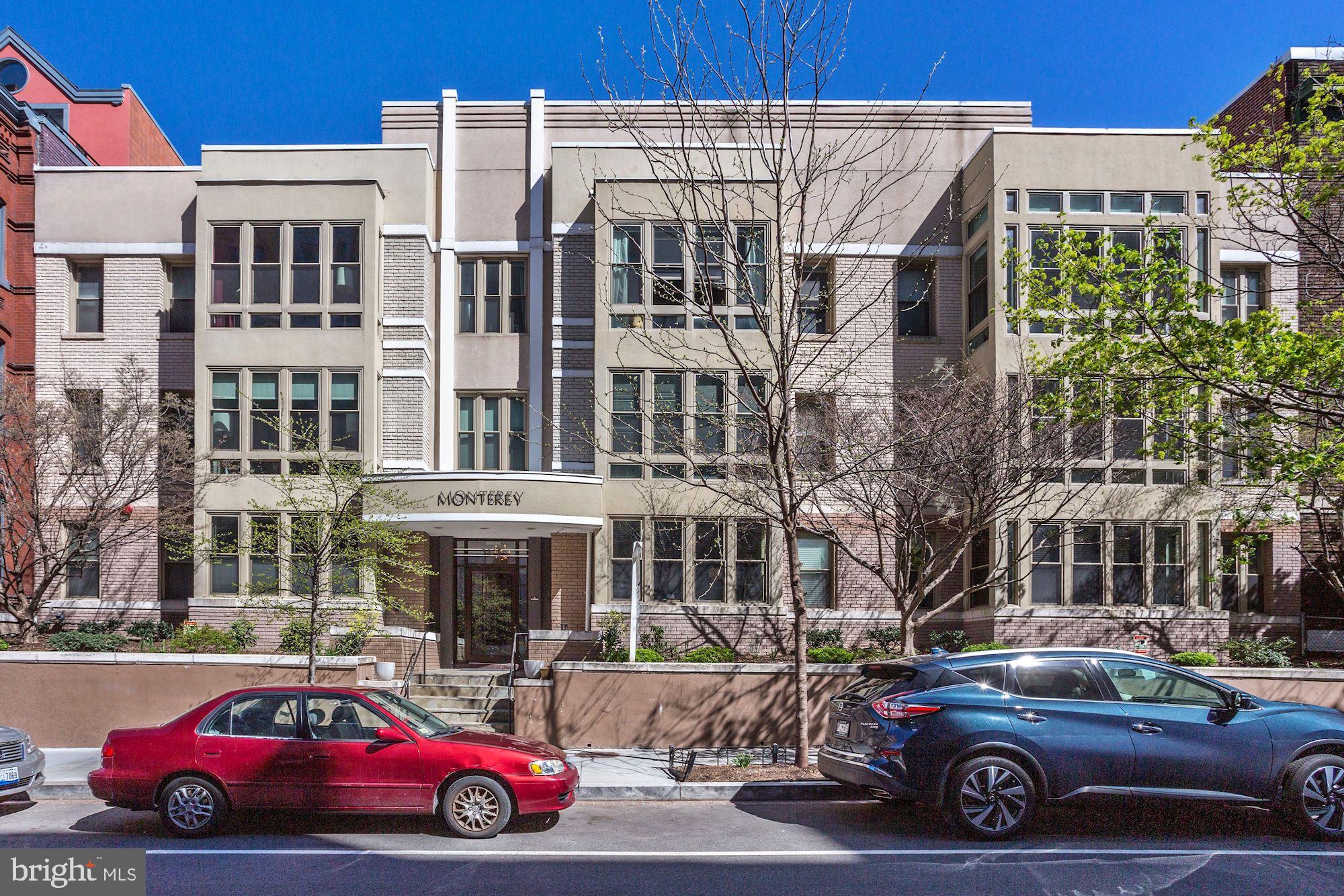 1445 N Street Northwest, Unit 202 Washington, DC 20005 - Photo 1 of 23 a cars parked in front of a building