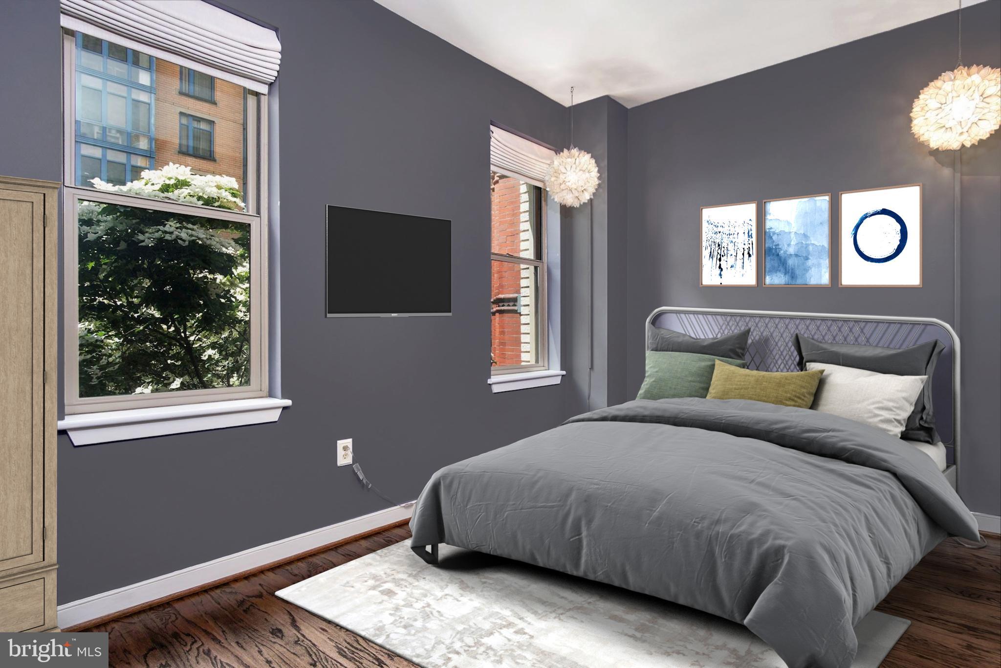 1445 N Street Northwest, Unit 202 Washington, DC 20005 - Photo 10 of 23 a bedroom with a bed and a window